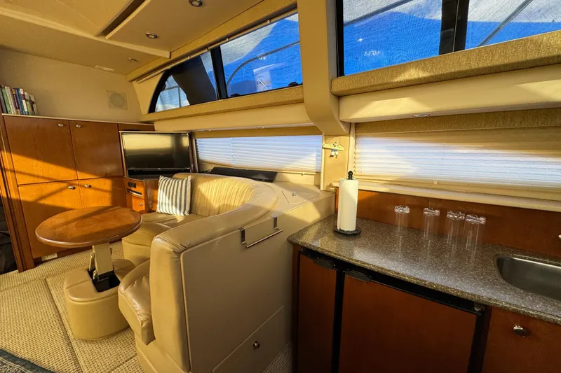 Slide: The Image of Luxurious interior of 2005 Meridian 368 Motoryacht with seating, table, and kitchenette. - 37