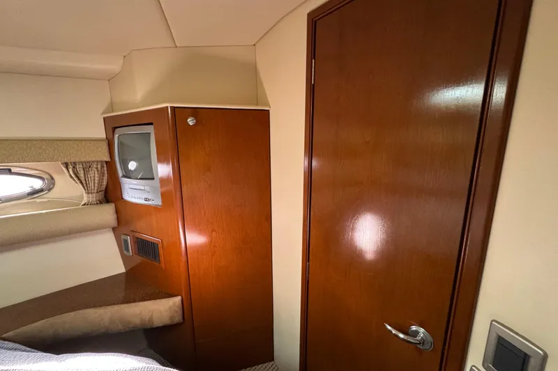 Slide: The Image of Interior of 2005 Meridian 368 Motoryacht with wood paneling and built-in TV. - 44