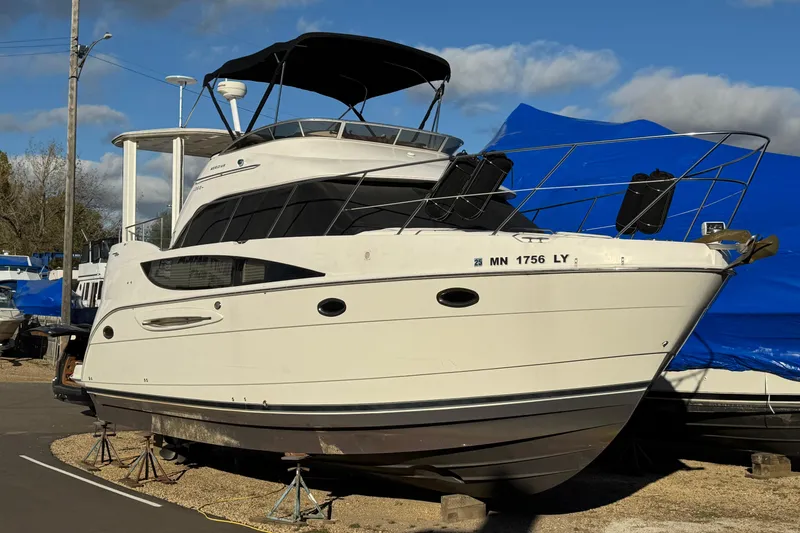 Slide: The Image of 2005 Meridian 368 Motoryacht on stands, outdoor storage, clear sky background. - 5