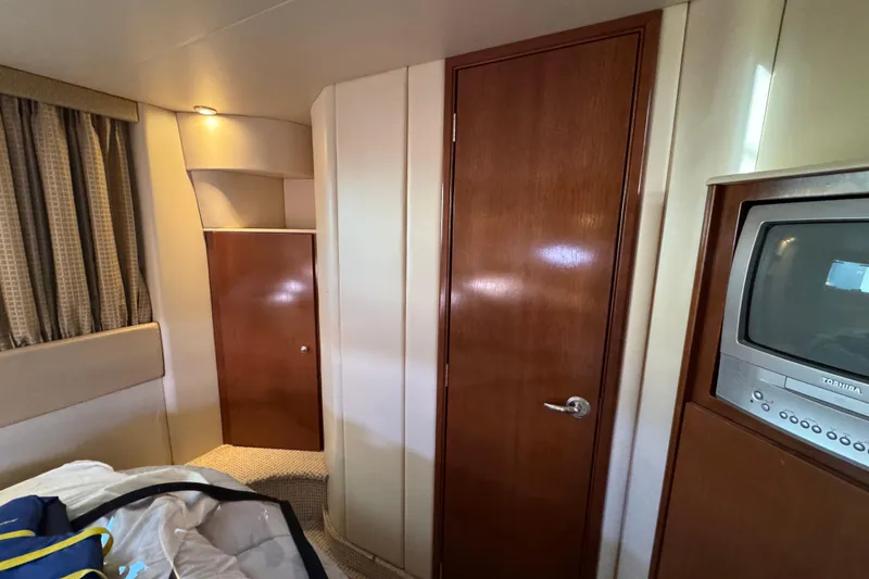 Slide: The Image of Interior of 2005 Meridian 368 Motoryacht with wood paneling and built-in TV. - 53