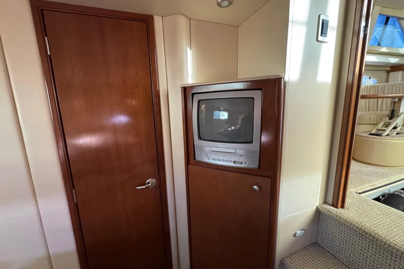 Slide: The Image of 2005 Meridian 368 Motoryacht interior with vintage TV and wooden cabinetry. - 57