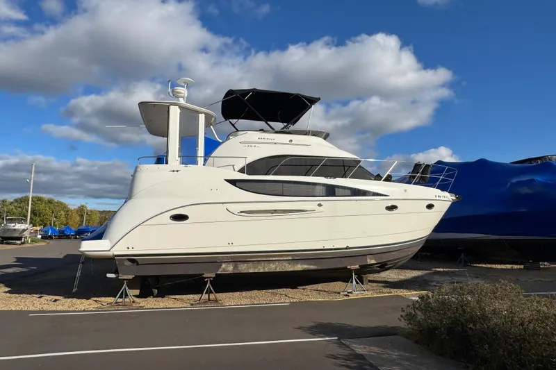 Slide: The Image of 2005 Meridian 368 Motoryacht on dry dock under a blue sky. - 6