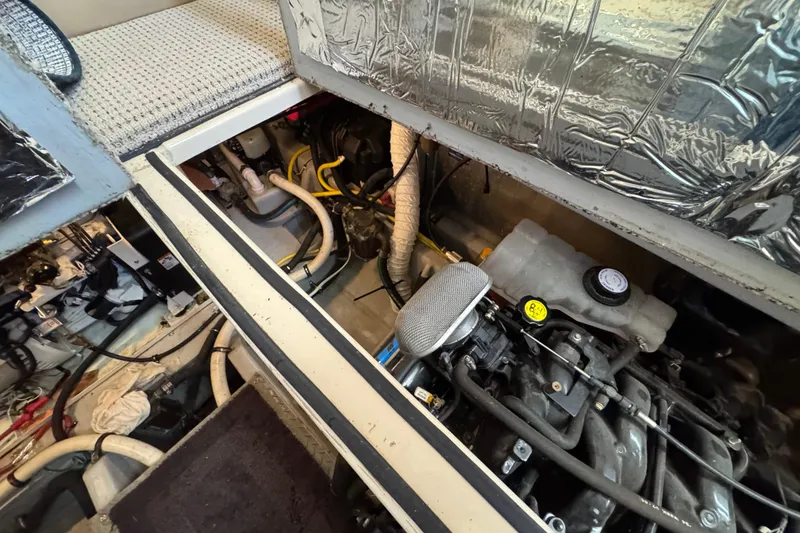 Slide: The Image of Engine room of a 2005 Meridian 368 Motoryacht, showcasing mechanical components and wiring. - 60