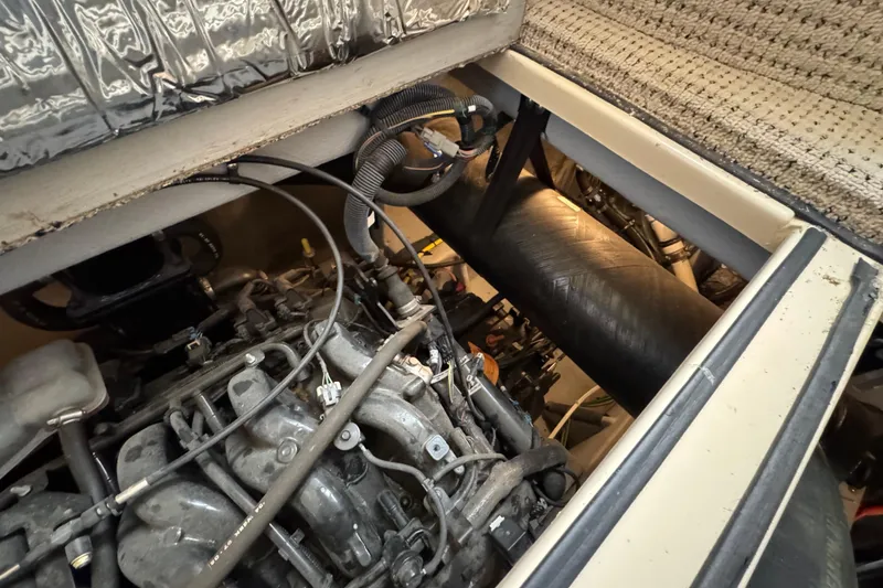 Slide: The Image of Engine compartment of a 2005 Meridian 368 Motoryacht, showcasing mechanical components. - 61