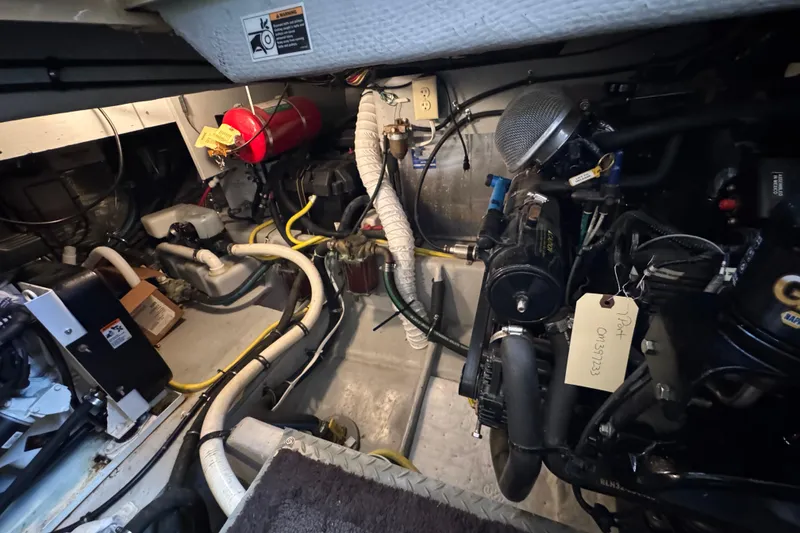Slide: The Image of Engine room of 2005 Meridian 368 Motoryacht with visible machinery and wiring. - 63