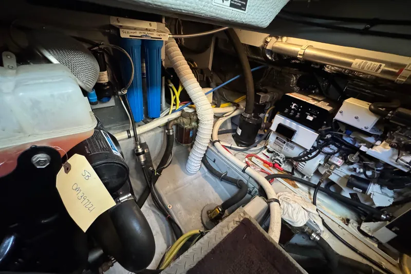 Slide: The Image of Engine room of 2005 Meridian 368 Motoryacht with various mechanical components. - 64