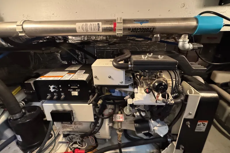 Slide: The Image of Engine room of 2005 Meridian 368 Motoryacht showcasing mechanical components and systems. - 67