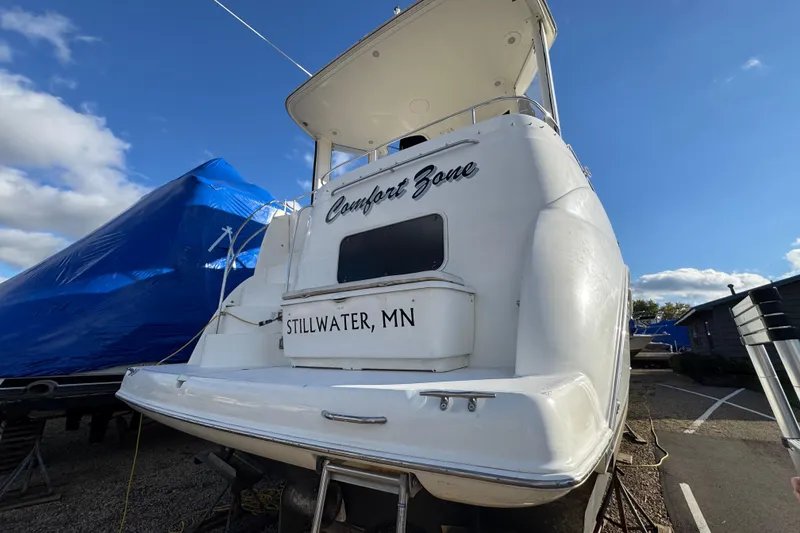 Slide: The Image of 2005 Meridian 368 Motoryacht named "Comfort Zone" in Stillwater, MN, under clear skies. - 8