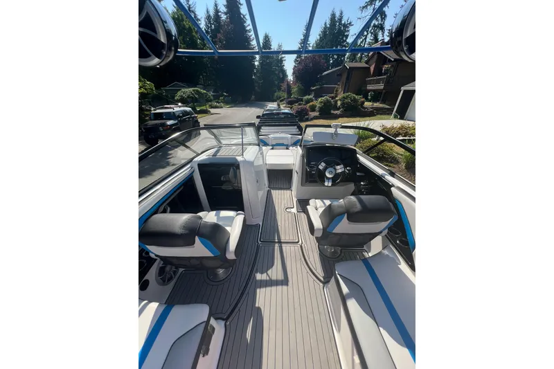 Slide: The Image of 2018 Yamaha Boats 242X interior with sleek seating and modern dashboard. - 7