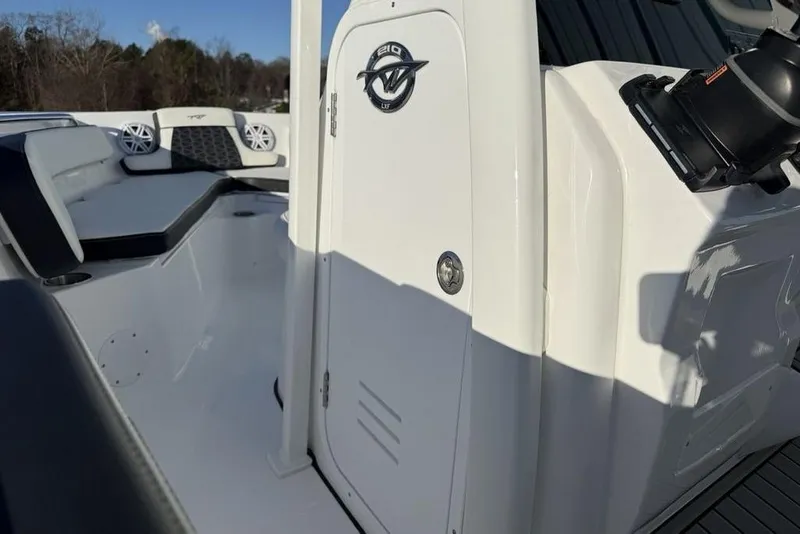 Slide: The Image of 2026 Tidewater 210 LXF boat interior with seating and storage compartment. - 18