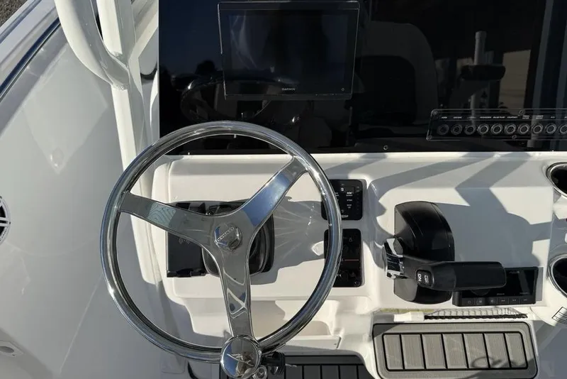 Slide: The Image of Steering console of 2026 Tidewater 210 LXF boat with modern controls and display. - 20
