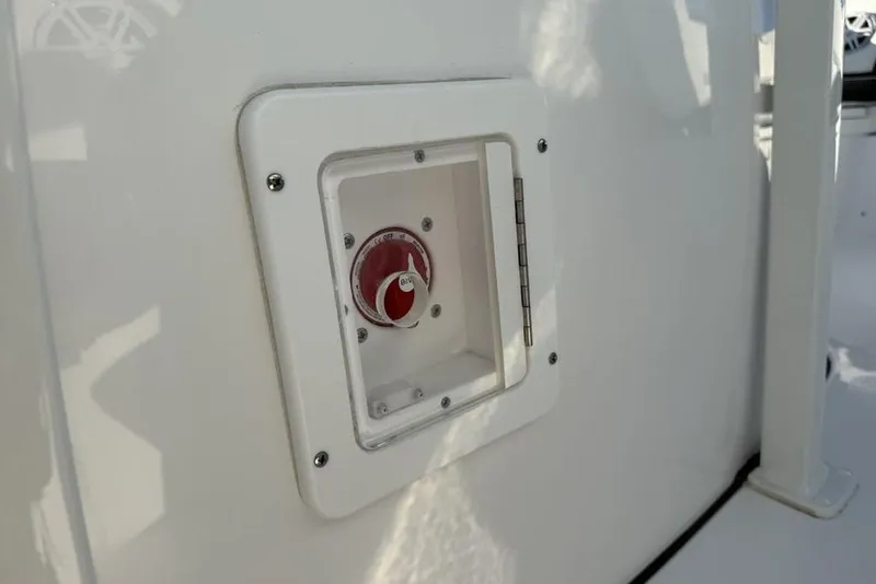 Slide: The Image of 2026 Tidewater 210 LXF boat control panel with red dial switch. - 24