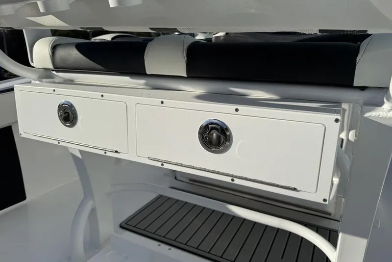Slide: The Image of 2026 Tidewater 210 LXF boat storage compartments with sleek design and modern features. - 28