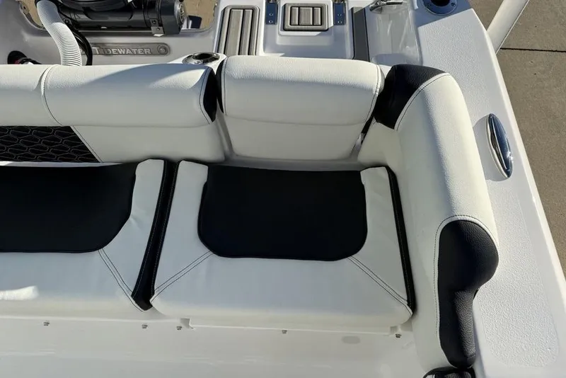 Slide: The Image of 2026 Tidewater 210 LXF boat seating with black and white upholstery. - 29