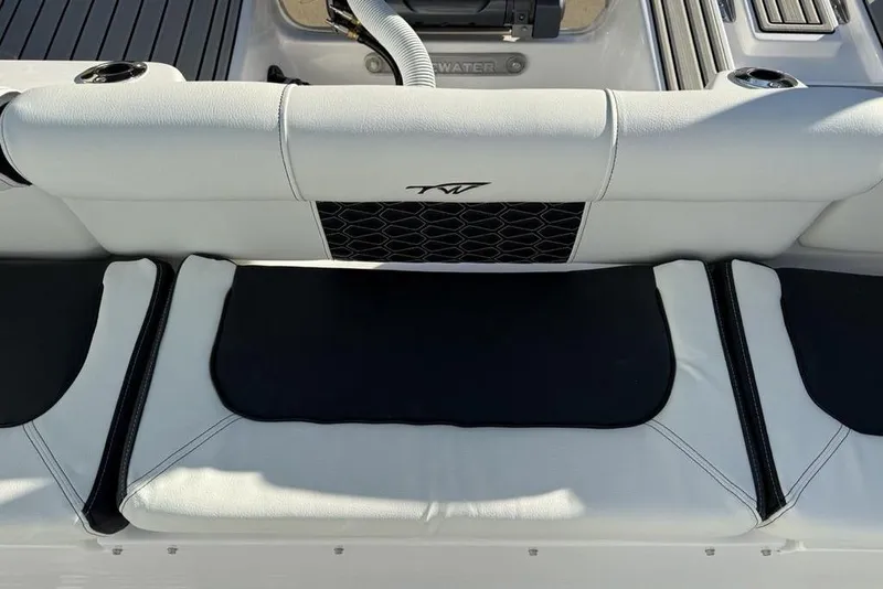 Slide: The Image of 2026 Tidewater 210 LXF boat interior with white and black seating. - 32