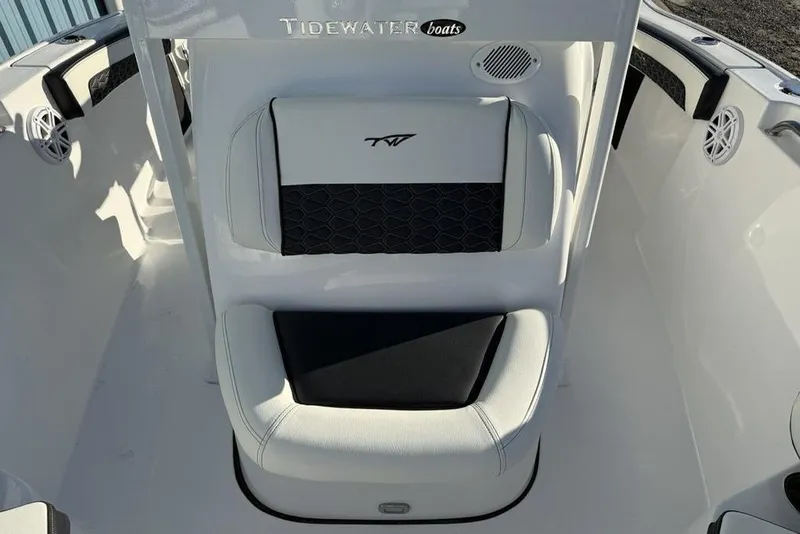 Slide: The Image of 2026 Tidewater 210 LXF boat interior with white and black seating. - 8