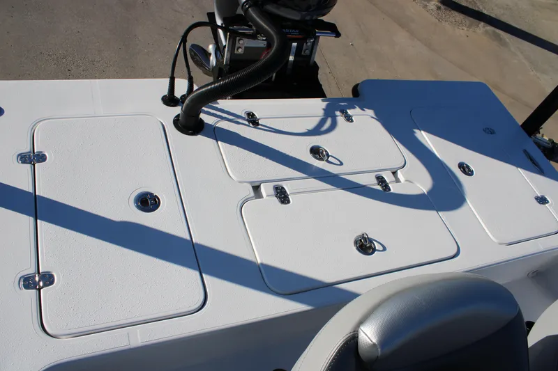 Slide: The Image of Mamba 227VX 2026 boat deck with storage compartments and seating. - 10