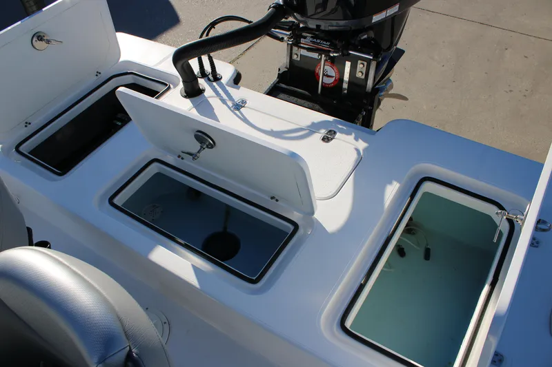 Slide: The Image of 2026 Mamba 227VX boat interior with storage compartments and motor. - 11