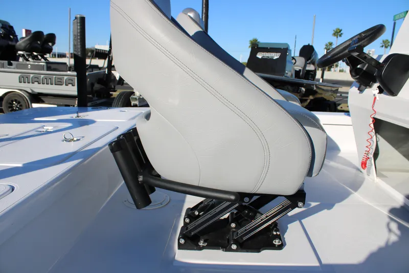Slide: The Image of Mamba 227VX 2026 boat interior with adjustable seating and steering wheel. - 16