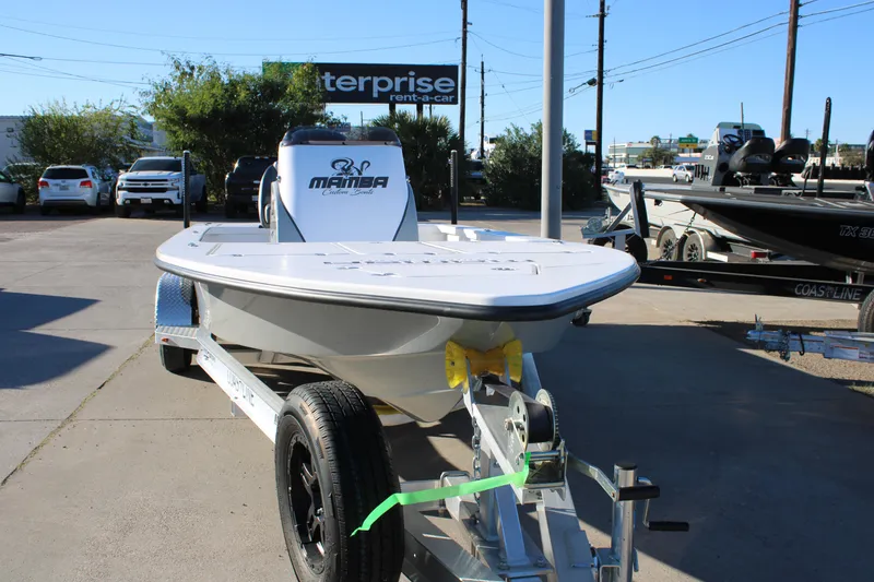 Slide: The Image of 2026 Mamba 227VX boat on trailer in parking lot, sunny day. - 19
