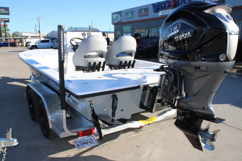 Slide: The Image of 2026 Mamba 227VX boat with Yamaha engine on trailer in dealership lot. - 2