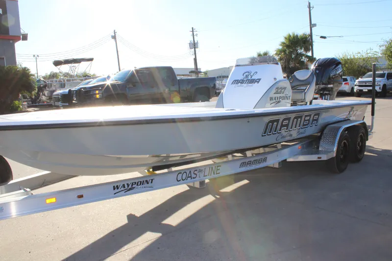Slide: The Image of 2026 Mamba 227VX boat on trailer in sunny outdoor setting. - 20