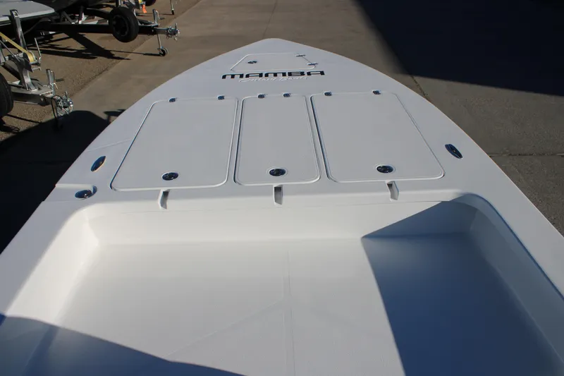 Slide: The Image of 2026 Mamba 227VX boat deck with storage compartments and sleek design. - 5