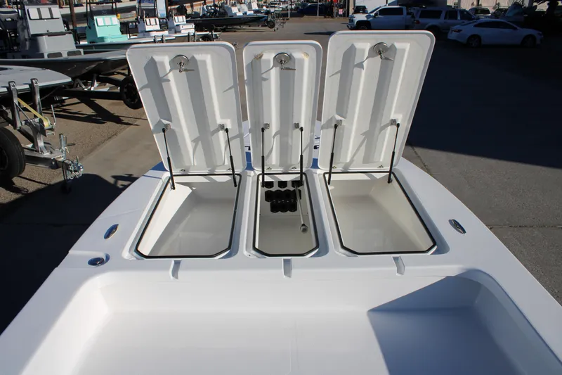 Slide: The Image of Open storage compartments on a 2026 Mamba 227VX boat, showcasing ample space. - 6
