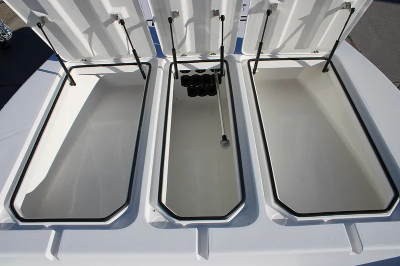 Slide: The Image of Open storage compartments on Mamba 227VX boat, 2026 model, showcasing spacious interior design. - 7