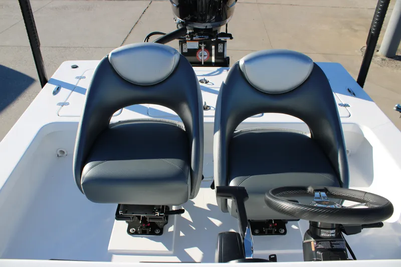 Slide: The Image of Dual seats and steering wheel on 2026 Mamba 227VX boat deck. - 9
