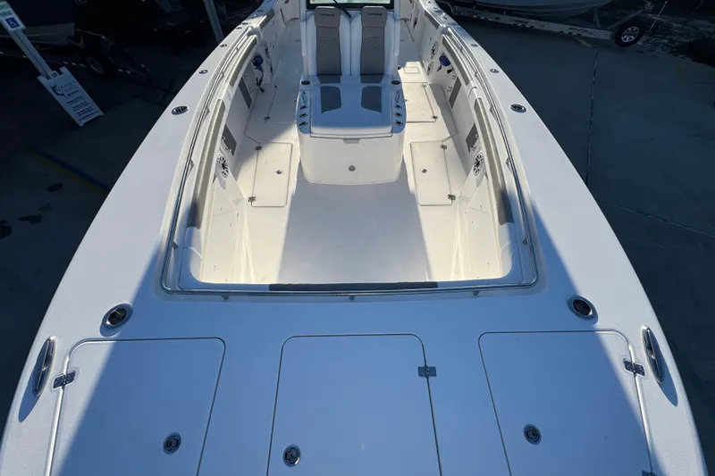 Slide: The Image of 2026 Caymas 34 CT boat deck, spacious seating, and storage compartments. - 12