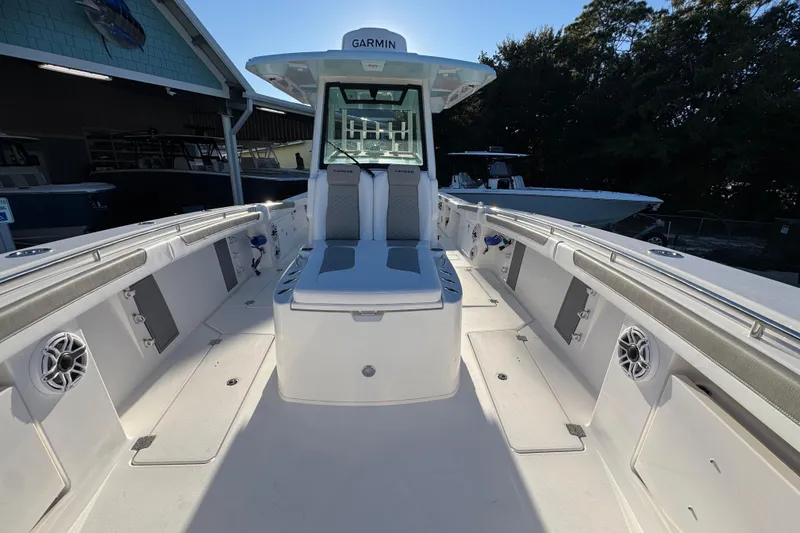 Slide: The Image of 2026 Caymas 34 CT boat interior with seating and Garmin equipment. - 14