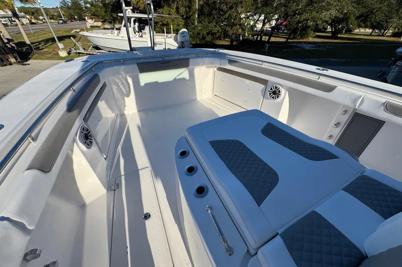 Slide: The Image of 2026 Caymas 34 CT boat interior with cushioned seating and speakers. - 16