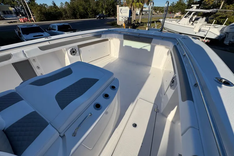 Slide: The Image of 2026 Caymas 34 CT boat interior with seating and storage compartments. - 17