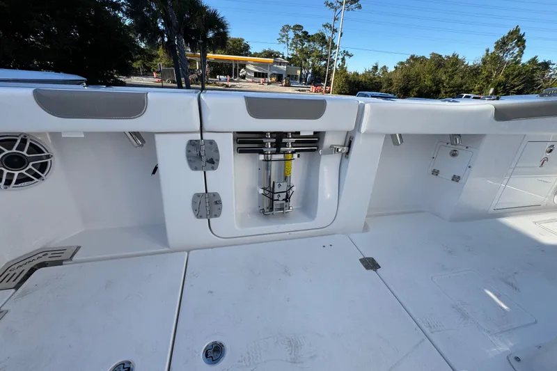 Slide: The Image of 2026 Caymas 34 CT boat deck with storage compartments and speaker. - 31