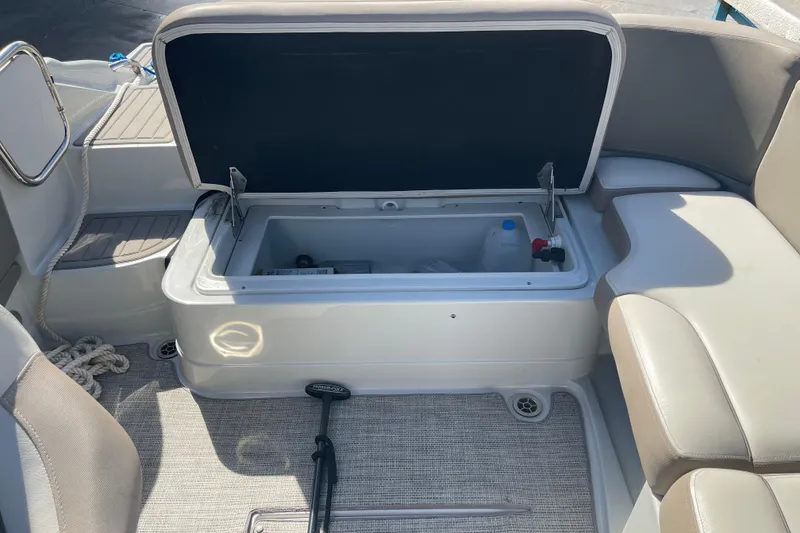 Slide: The Image of 2019 Crownline Eclipse E205 XS boat interior with open storage compartment. - 12