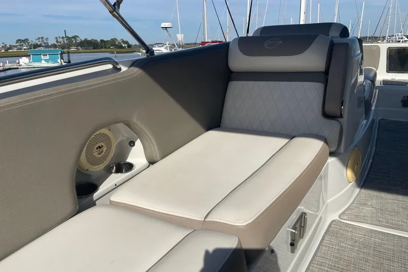 Slide: The Image of 2019 Crownline Eclipse E205 XS boat interior with cushioned seating and speaker. - 13