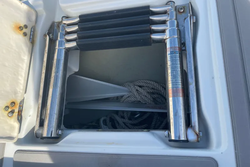 Slide: The Image of 2019 Crownline Eclipse E205 XS boat ladder and storage compartment with rope. - 14