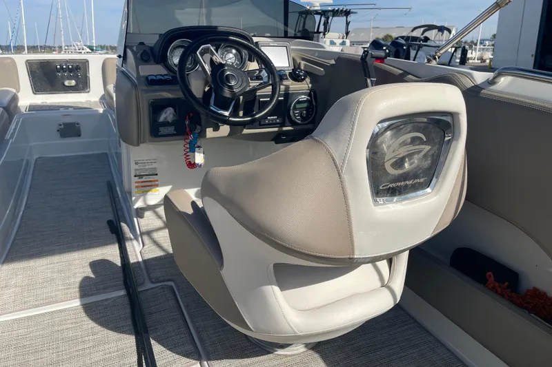 Slide: The Image of 2019 Crownline Eclipse E205 XS boat interior with steering wheel and captain's chair. - 17