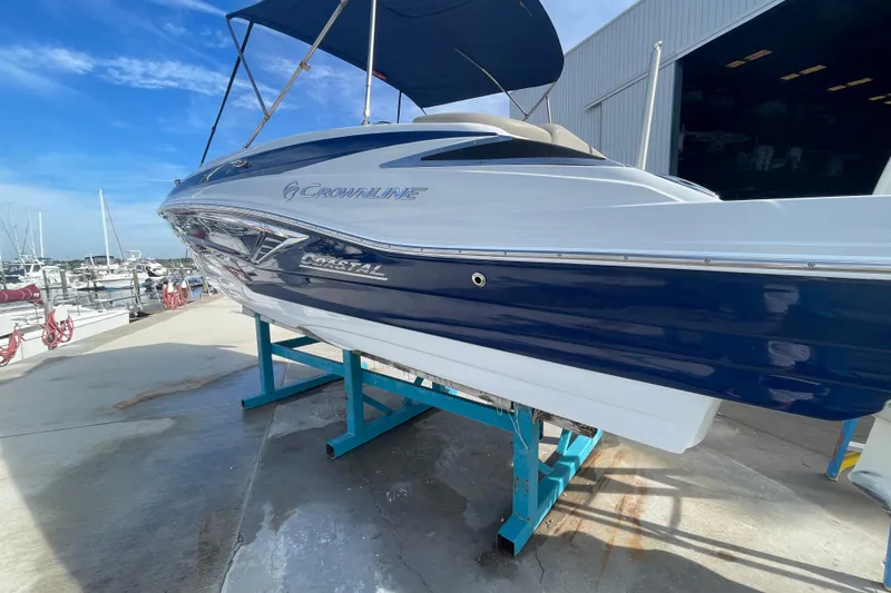 Slide: The Image of 2019 Crownline Eclipse E205 XS boat on display at marina. - 2
