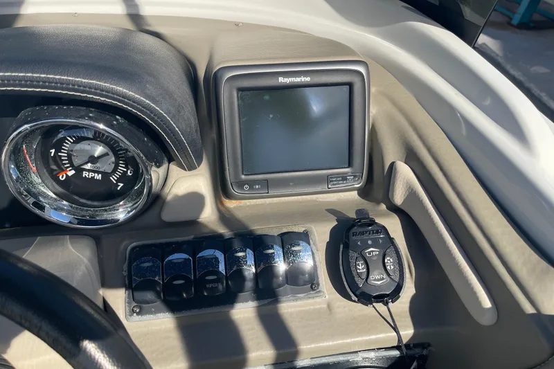 Slide: The Image of 2019 Crownline Eclipse E205 XS dashboard with RPM gauge and Raymarine display. - 20