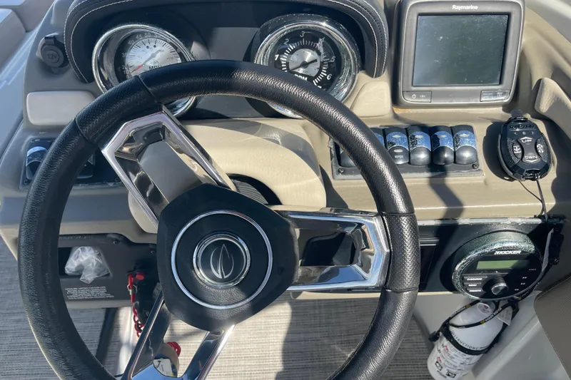 Slide: The Image of Steering wheel and dashboard of 2019 Crownline Eclipse E205 XS boat. - 21