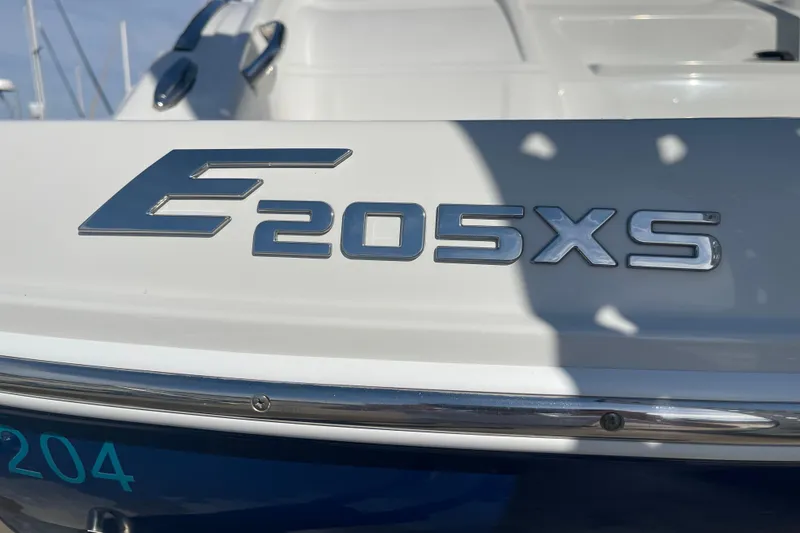 Slide: The Image of 2019 Crownline Eclipse E205 XS boat emblem in sunlight. - 4