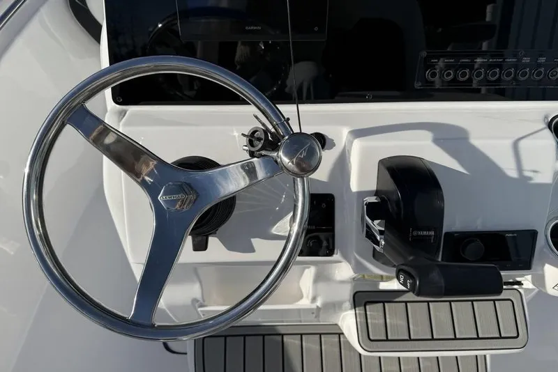 Slide: The Image of Steering wheel and controls of 2026 Tidewater 198 CC Adventure boat. - 14