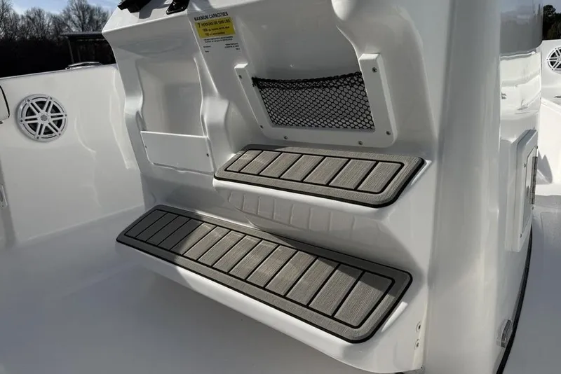 Slide: The Image of 2026 Tidewater 198 CC Adventure boat interior with non-slip steps and storage net. - 16