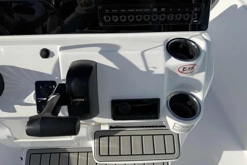 Slide: The Image of 2026 Tidewater 198 CC Adventure boat console with Yamaha controls and cup holders. - 18