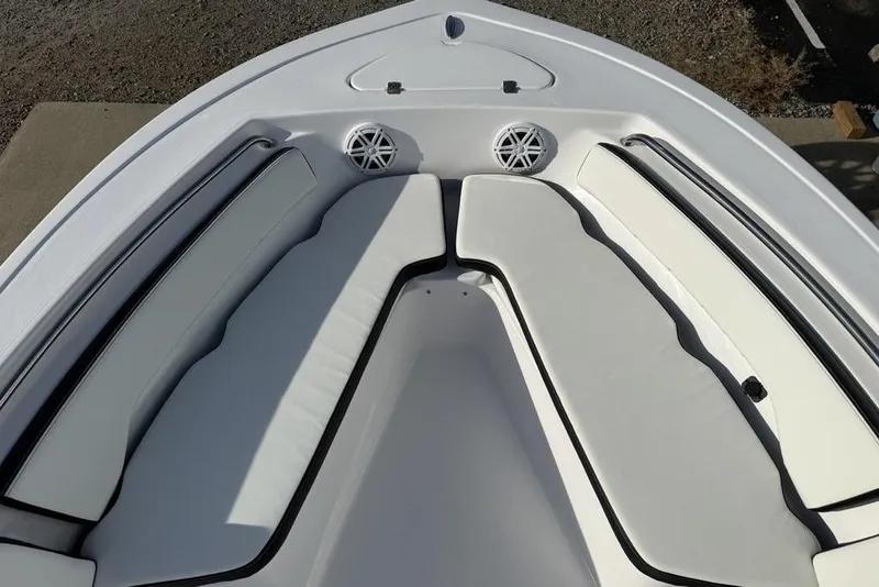 Slide: The Image of 2026 Tidewater 198 CC Adventure boat interior with cushioned seating and speakers. - 2