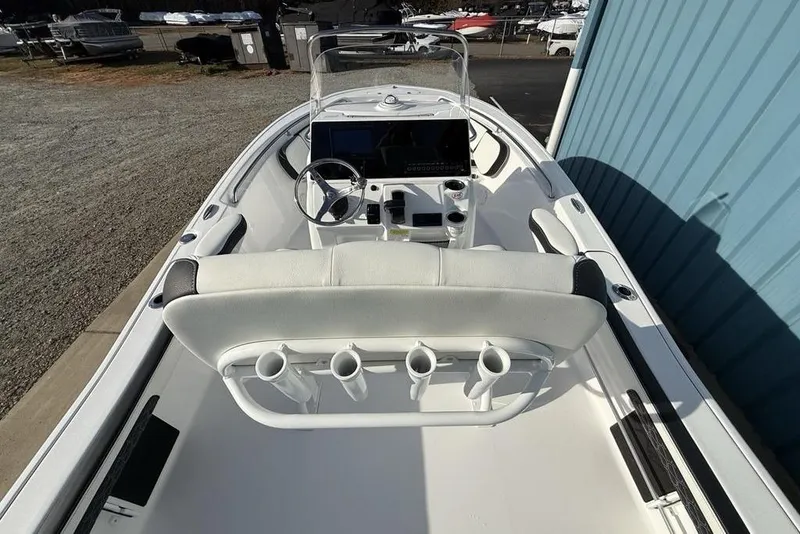 Slide: The Image of 2026 Tidewater 198 CC Adventure boat interior with steering console and seating. - 26