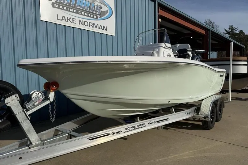 Slide: The Image of 2026 Tidewater 198 CC Adventure boat on trailer at Lake Norman marine center. - 4