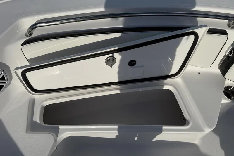 Slide: The Image of 2026 Tidewater 198 CC Adventure boat storage compartment open, showcasing interior space. - 7